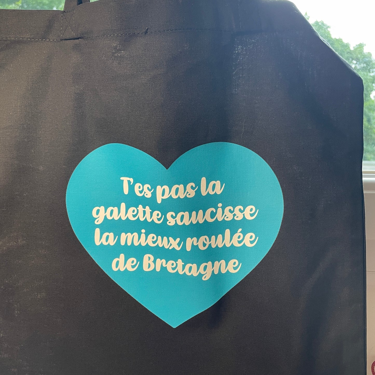 Tote bag en coton noir "T'es pas la galette saucisse la mieux roulée de Bretagne"