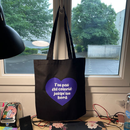 Tote bag en coton noir "T'as pas été colorié jusqu'au bord"