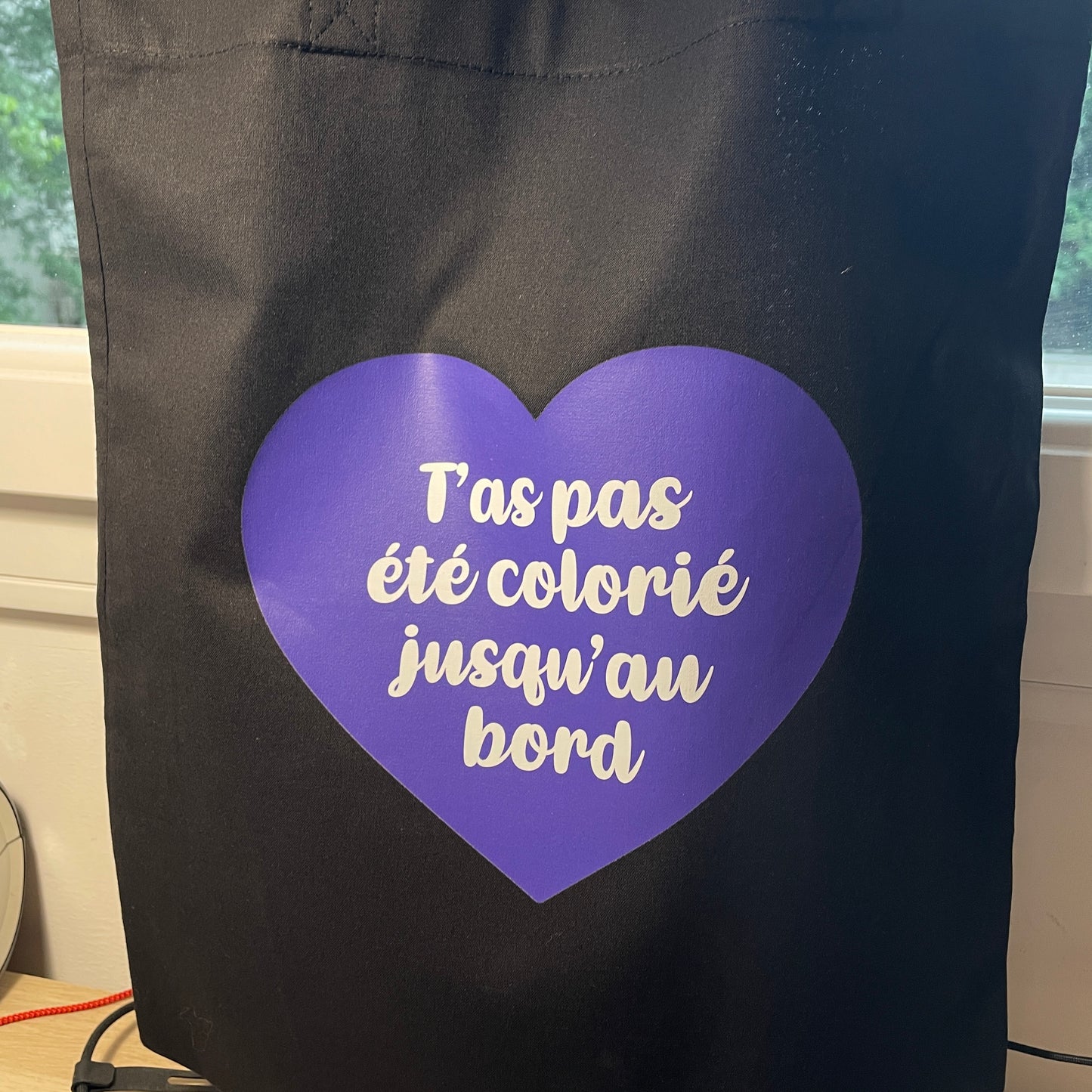 Tote bag en coton noir "T'as pas été colorié jusqu'au bord"