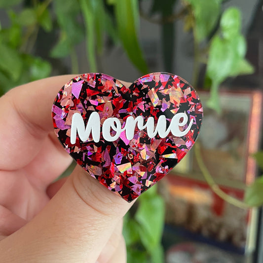 [CONTRÔLE TECHNIQUE] Broche "Morue" en acrylique noire avec des éclats de confettis rouges/roses