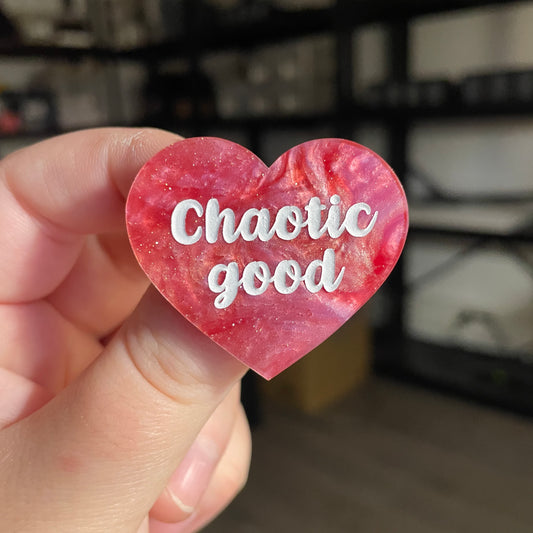 Broche "Chaotic good" en acrylique marbrée rose à paillettes