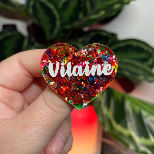 [CONTRÔLE TECHNIQUE] Broche "Vilaine" en acrylique transparente avec des confettis rouges et multicolores