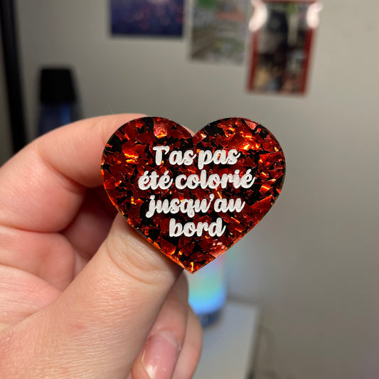 [Contrôle technique] Broche "T'as pas été colorié jusqu'au bord" en acrylique noire avec des éclats de confettis rouges