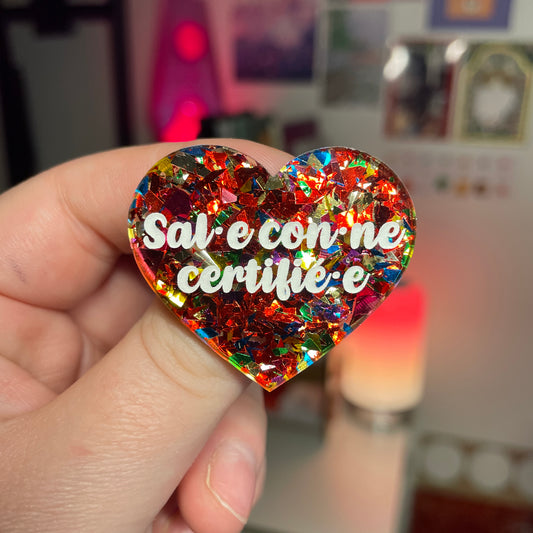 [Contrôle technique] [Inclusif] Broche "Sal.e con.ne certifié.e" en acrylique transparente avec des confettis rouges et multicolores