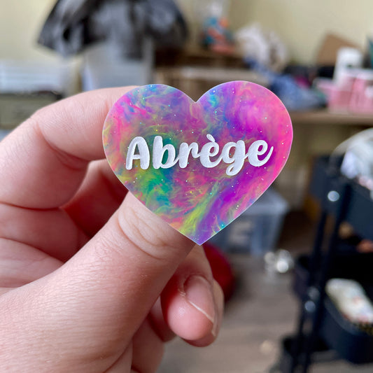 Broche "Abrège" en acrylique semi-transparente marbrée multicolore