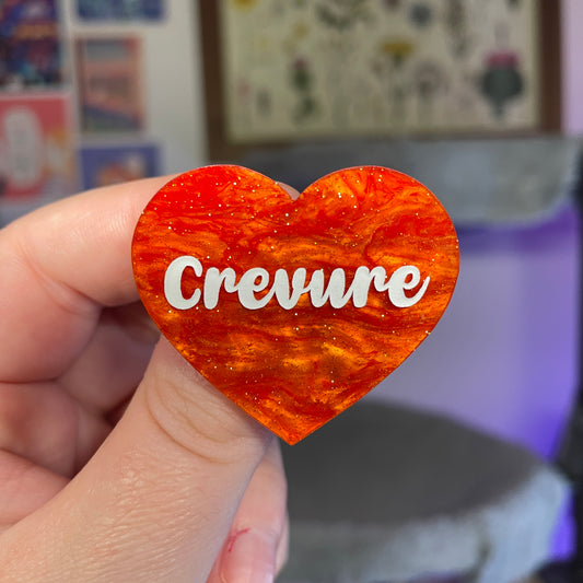 Broche "Crevure" en acrylique marbrée orange à paillettes