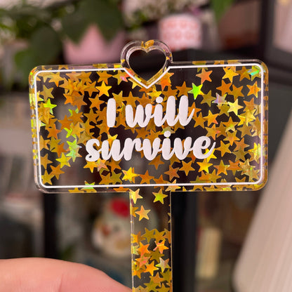 [CONTRÔLE TECHNIQUE] Pic à plante "I will survive" en acrylique transparente avec des paillettes dorées