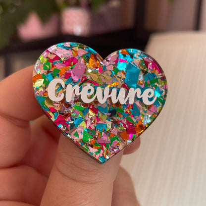 Broche "Crevure" en acrylique transparente avec des confettis multicolores