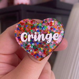 [CONTRÔLE TECHNIQUE] Broche "Cringe" en acrylique semi-transparente avec des confettis étoiles multicolores