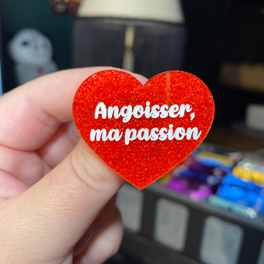 Broche "Angoisser, ma passion" en acrylique à paillettes oranges