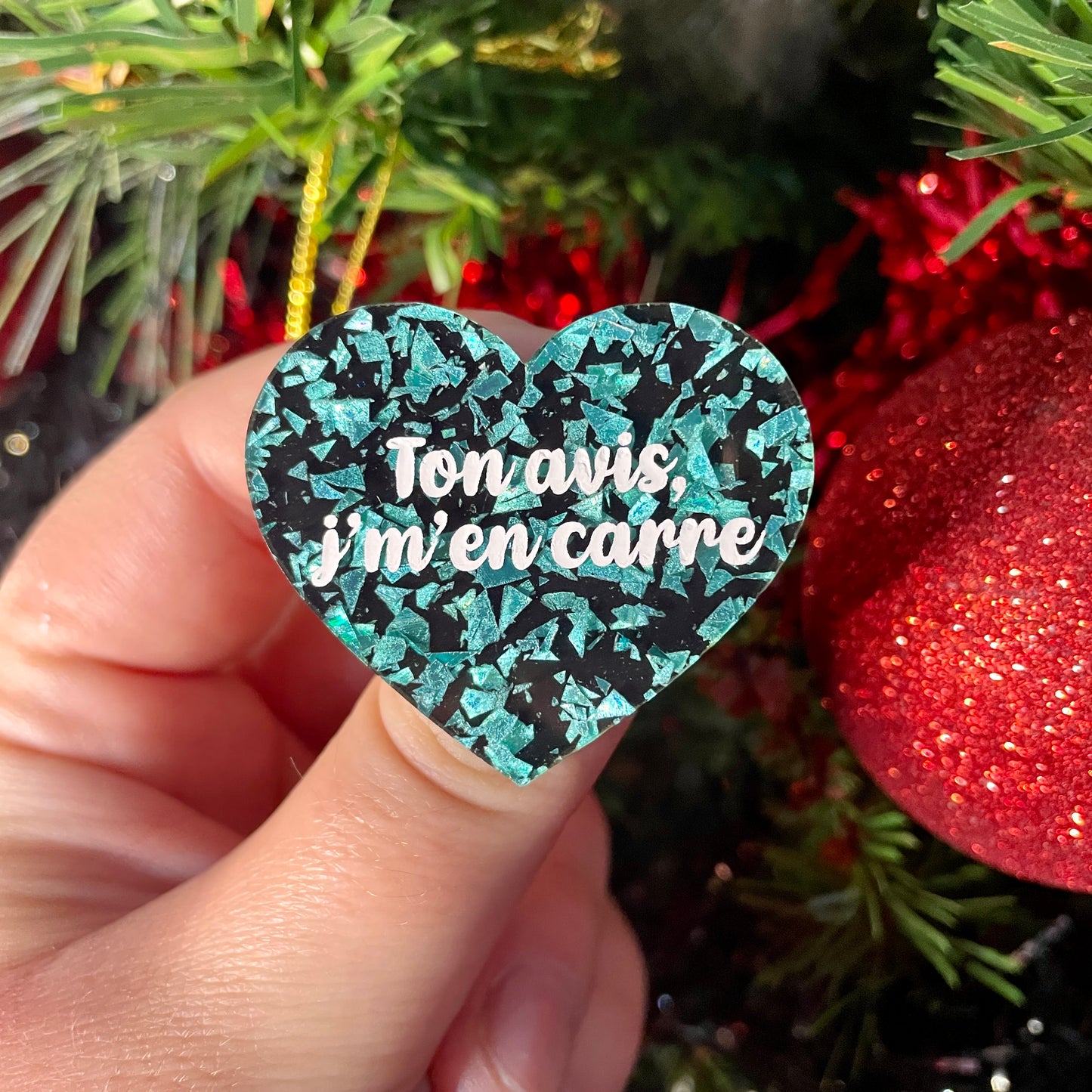 Broche "Ton avis j'm'en carre" en acrylique noire à confettis galactiques turquoise