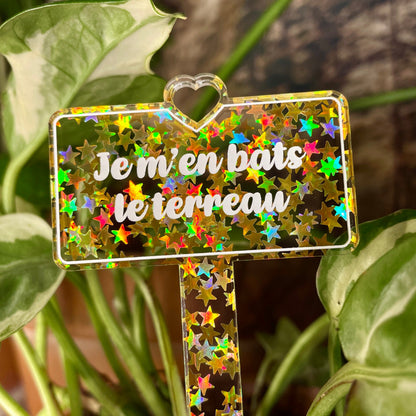 Pic à plante "Je m'en bats le terreau" en acrylique transparente avec des étoiles dorées