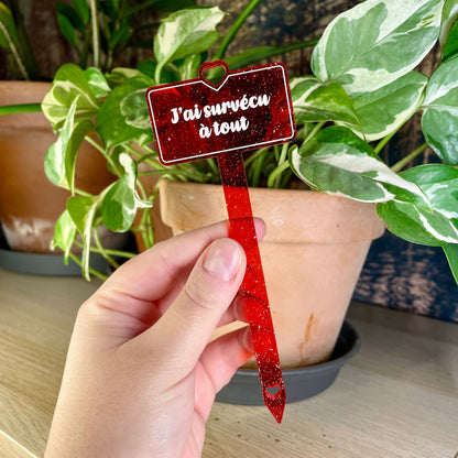 Pic à plante "J'ai survécu à tout" en acrylique transparente rouge à paillettes